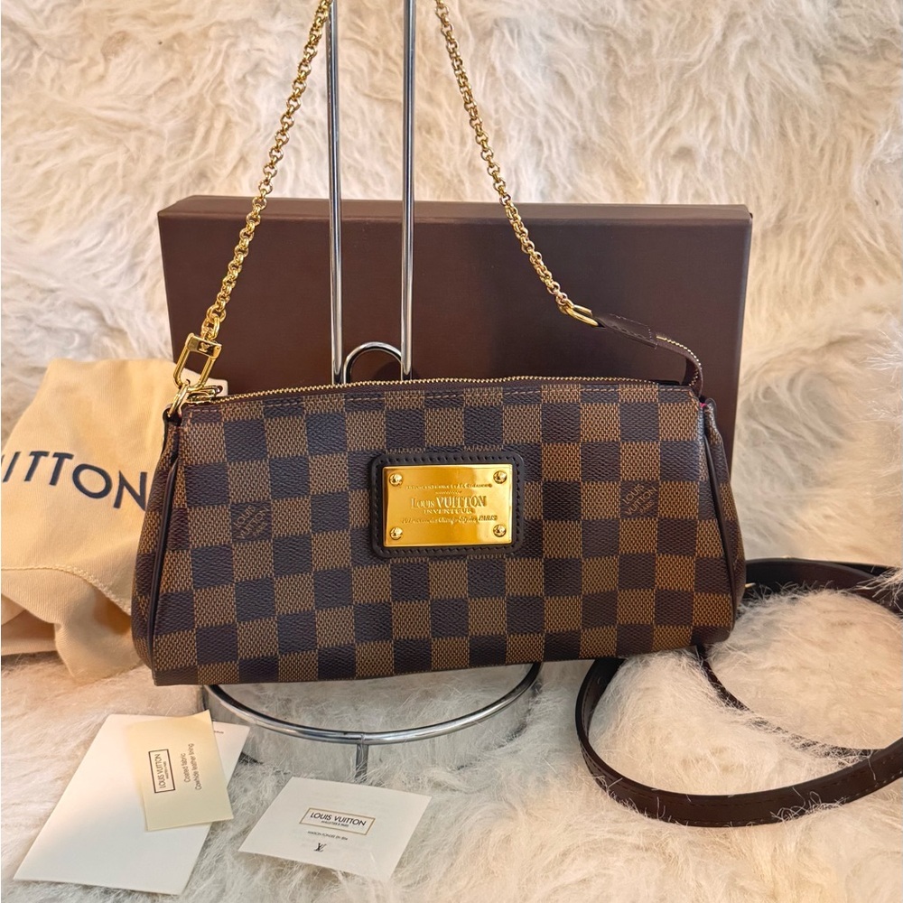 Louis Vuitton Brown Damier Ebene Clutch “EVA” (Discontinued) piece .